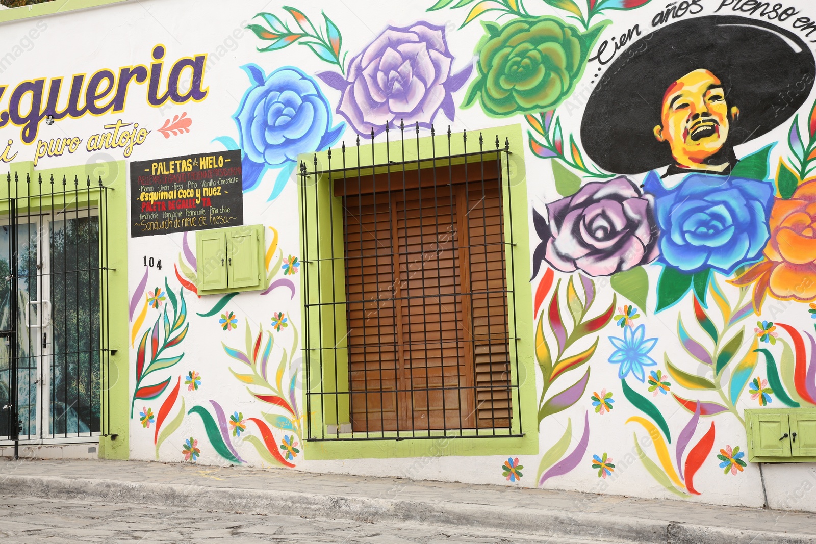 Photo of San Pedro Garza Garcia, Mexico – February 8, 2023: Building with beautiful traditional street art and window