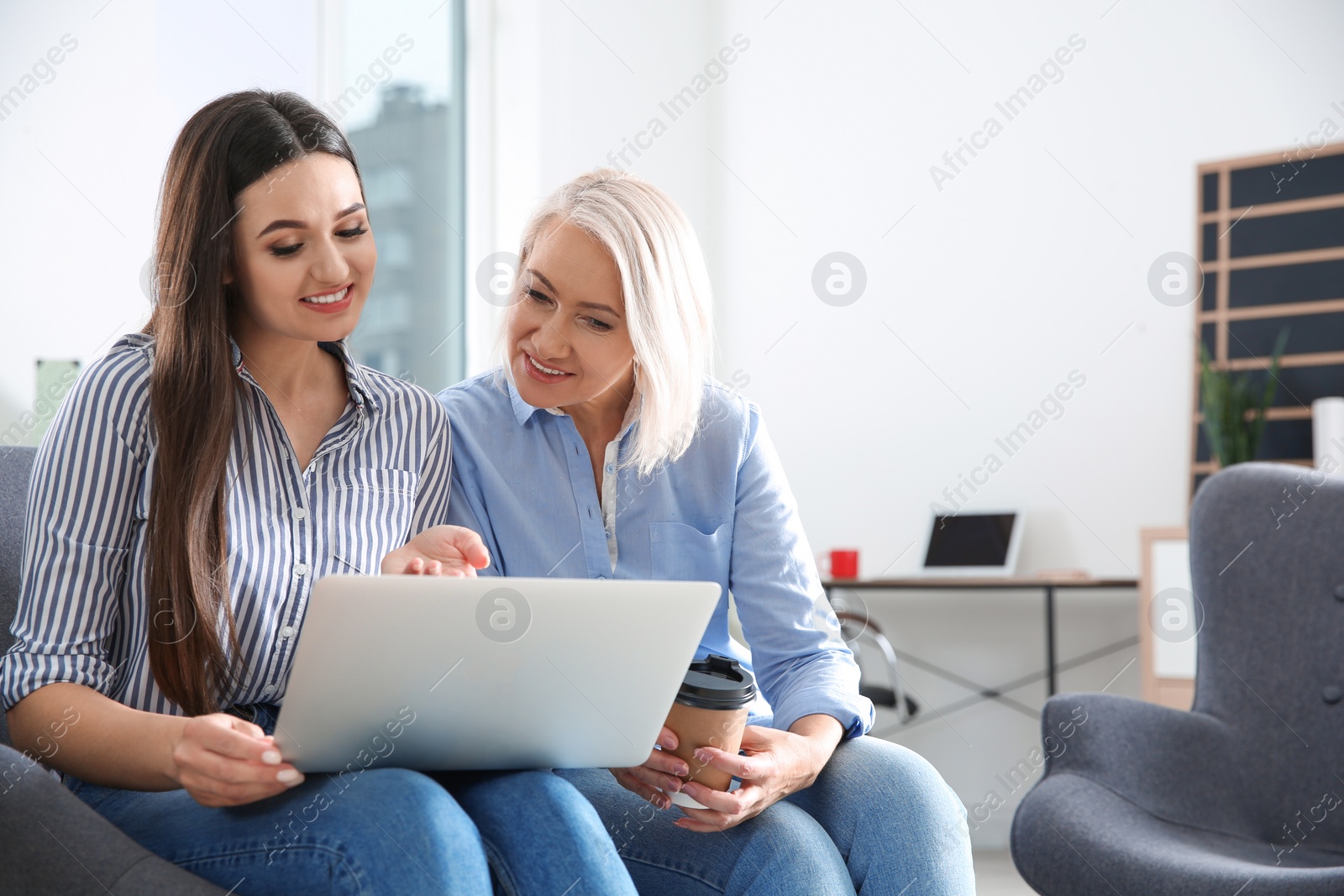 Photo of Business people working on laptop in office, space for text. Professional communication