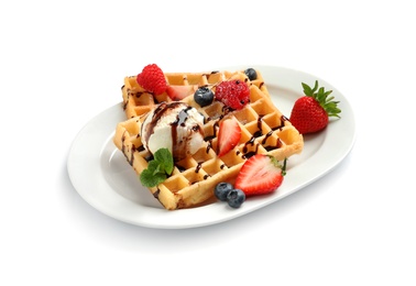 Photo of Plate with yummy waffles, berries and ice cream on white background