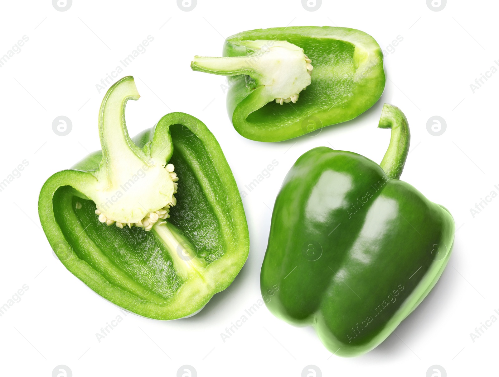 Photo of Whole and cut green bell peppers on white background, top view