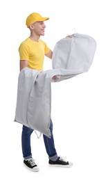 Dry-cleaning delivery. Happy courier holding garment cover with clothes on white background