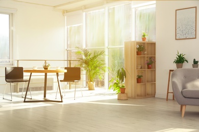 Photo of Trendy room interior with different home plants