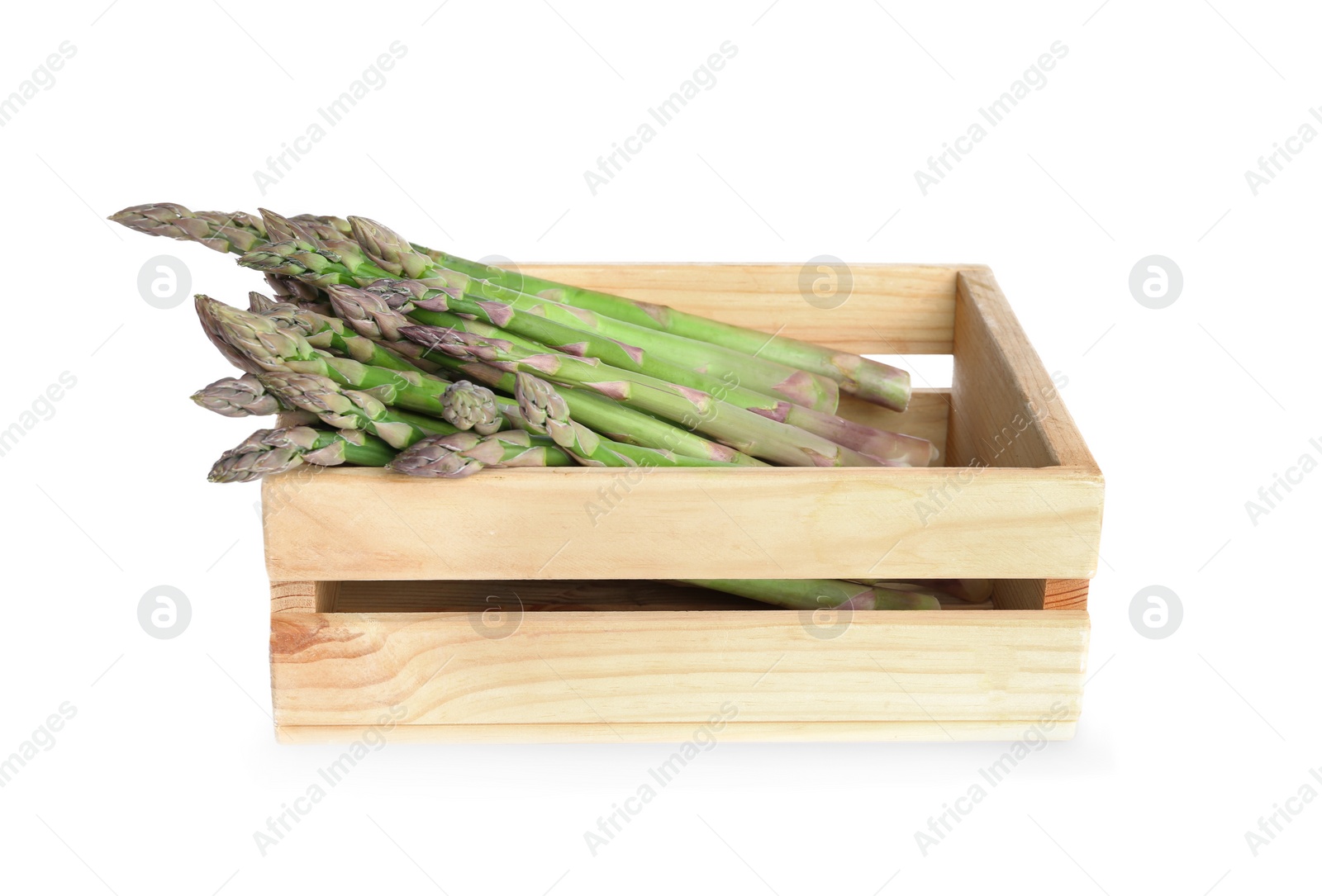 Photo of Fresh raw asparagus in wooden crate isolated on white