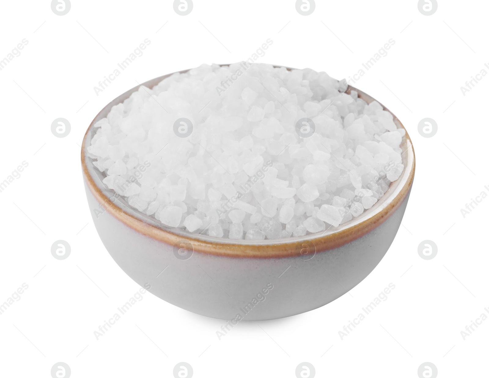 Photo of Ceramic bowl with natural sea salt isolated on white