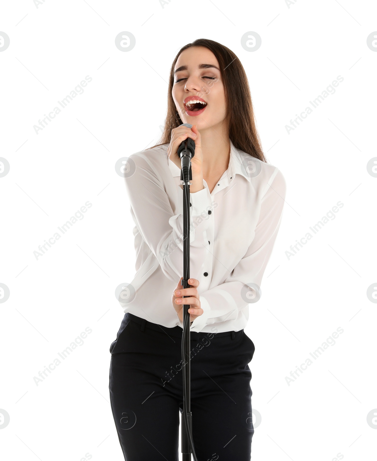 Photo of Young stylish woman singing in microphone on white background