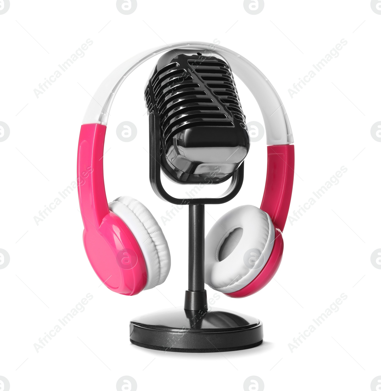 Photo of Retro microphone and headphones on white background