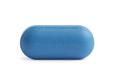 Photo of One blue pill on white background. Medicinal treatment