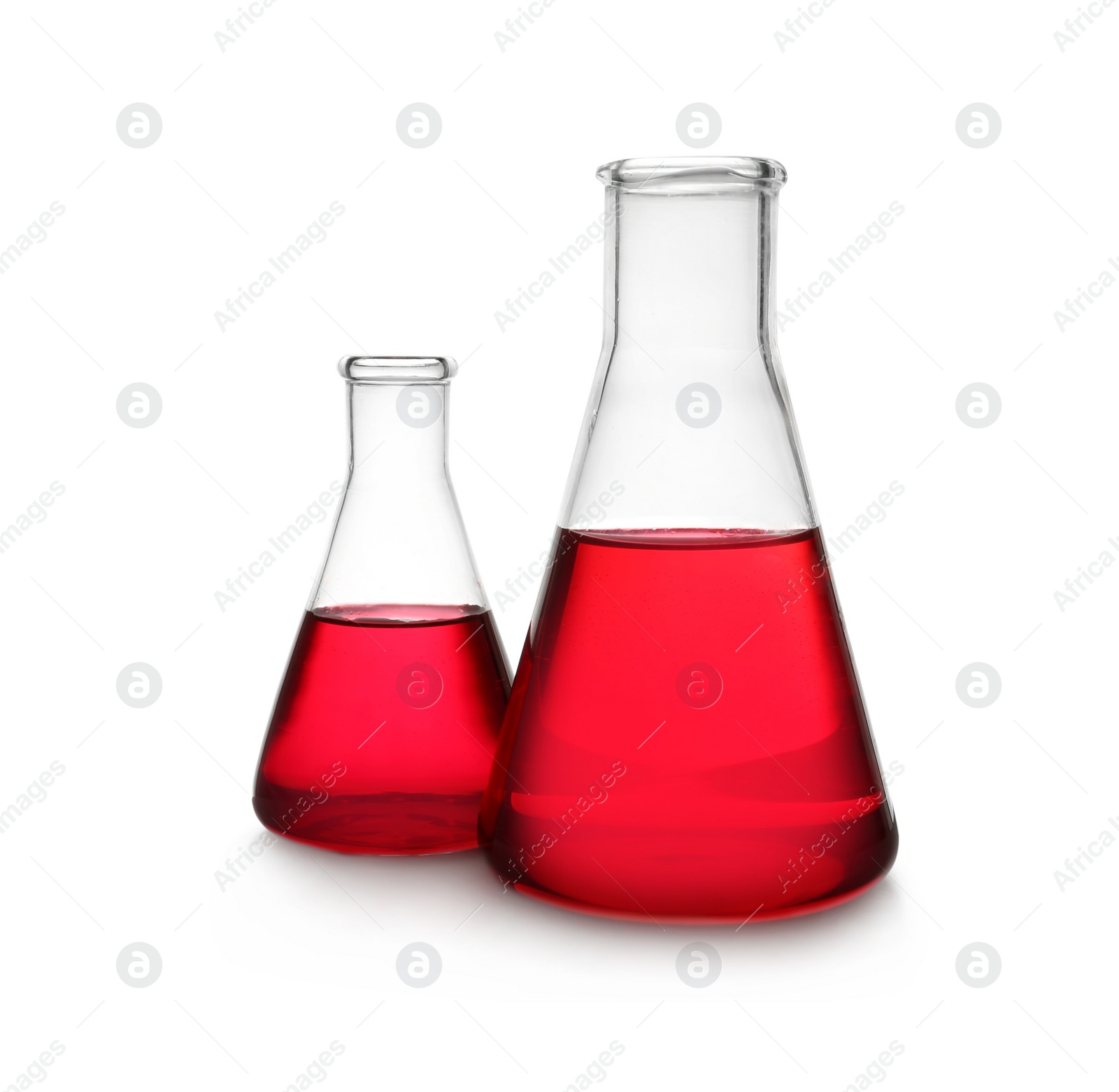 Photo of Conical flasks with red liquid on white background. Laboratory glassware