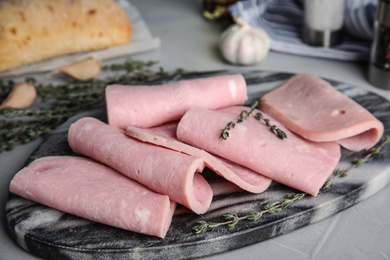 Photo of Tasty fresh ham on light grey table