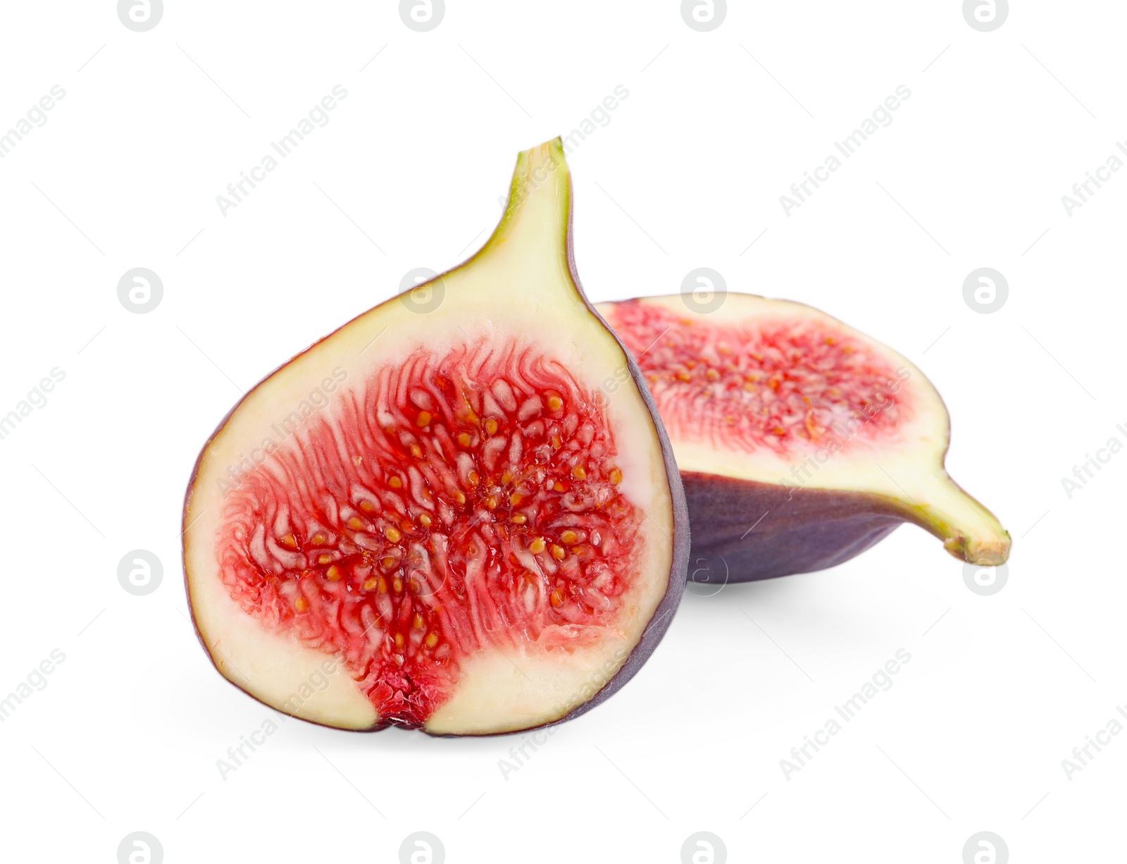 Photo of Halves of fresh fig isolated on white