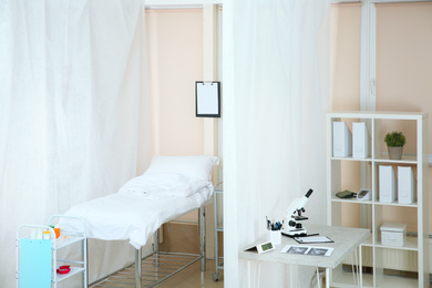 Photo of Modern interior of doctor's office with couch