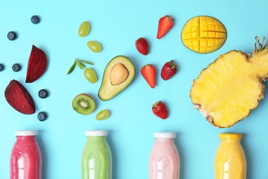 Flat lay composition with healthy detox smoothies and ingredients on color background