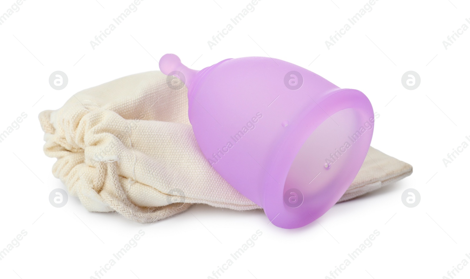 Photo of Silicone menstrual cup with cotton bag on white background