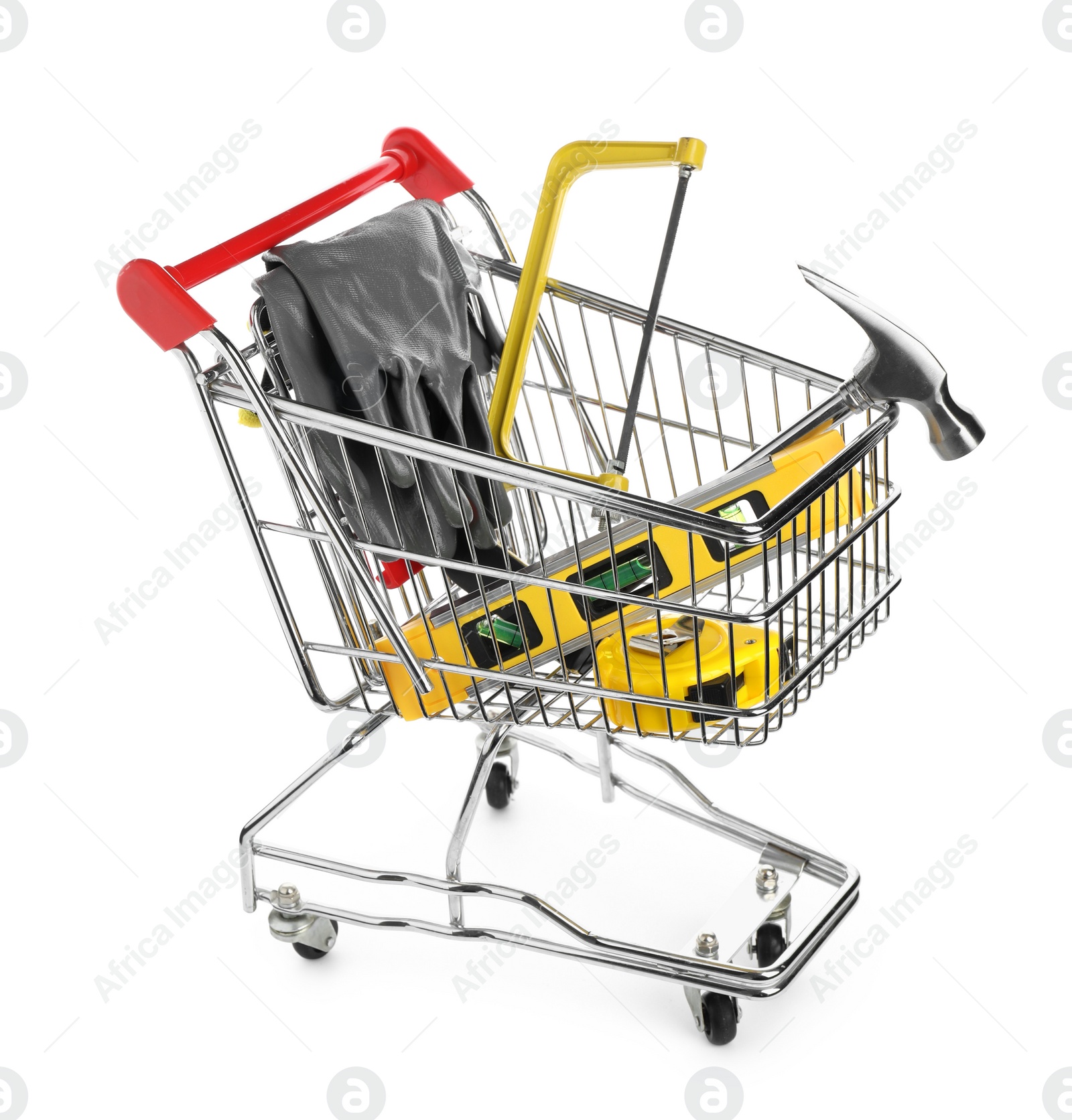 Photo of Small shopping cart with set of construction tools and gloves isolated on white