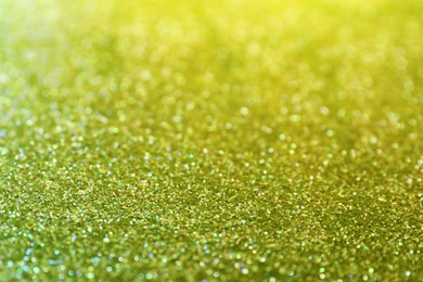 Shiny green glitter as background. Bokeh effect