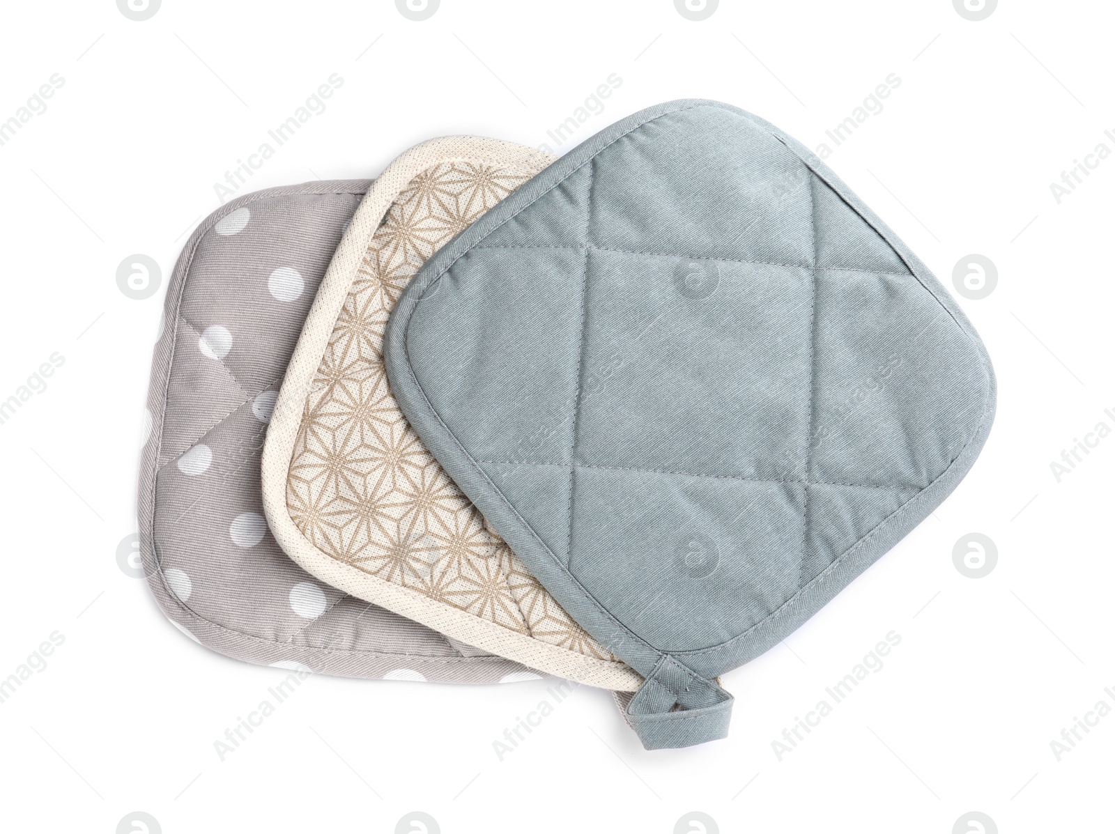 Photo of Oven potholders for hot dishes on white background, top view
