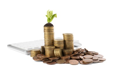 Photo of Stacks of coins with green plant and calculator on white background. Investment concept