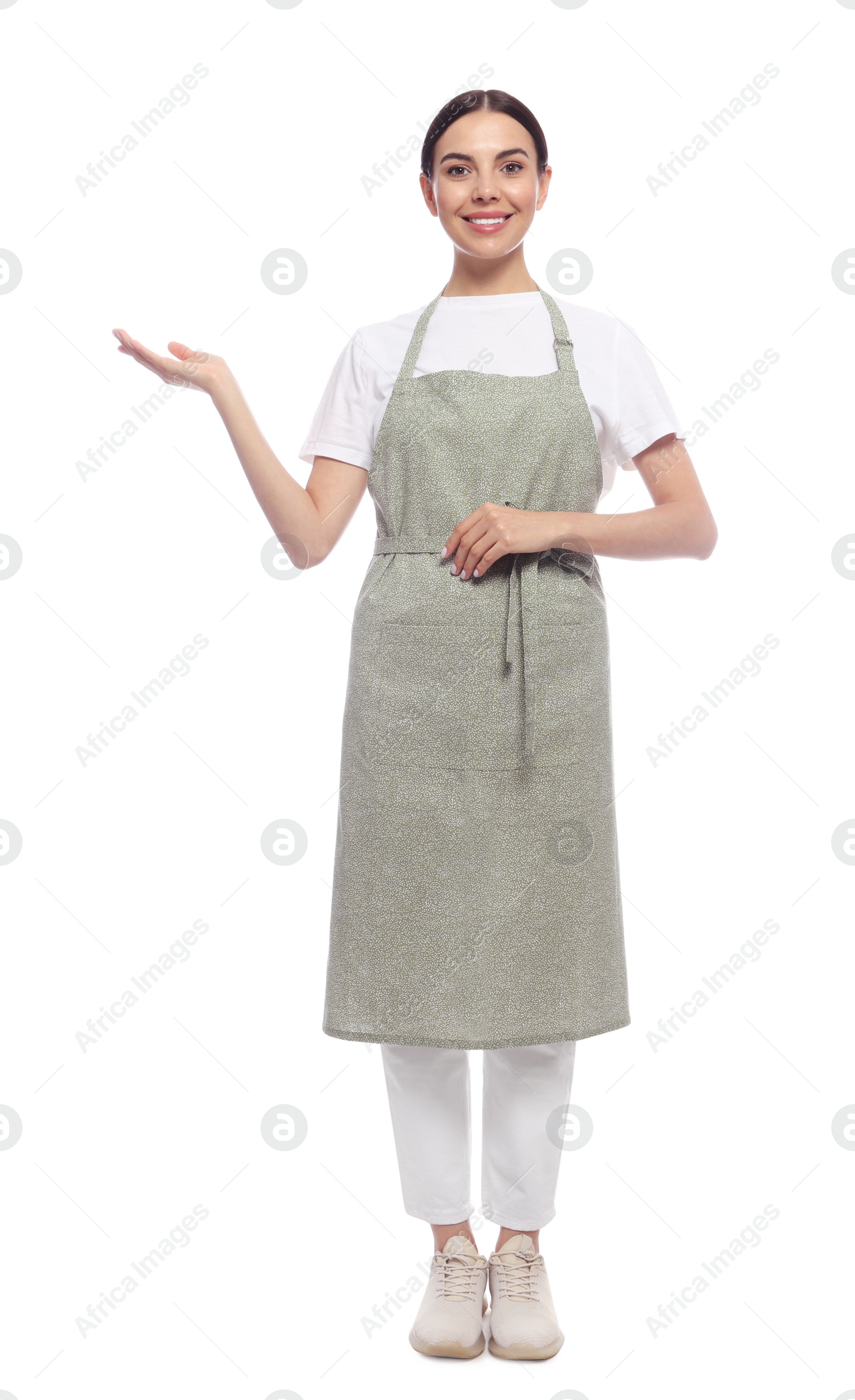 Photo of Young woman in light green apron on white background