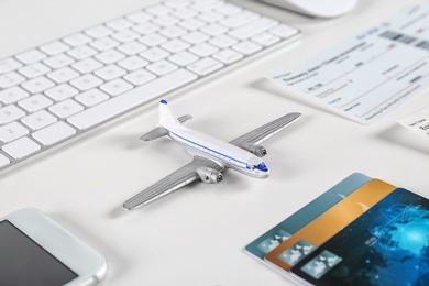 Photo of Composition with airplane model on table. Travel agency concept