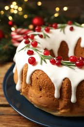 Photo of Traditional homemade Christmas cake on wooden table, closeup