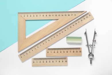 Photo of Flat lay composition with different rulers and compass on color background