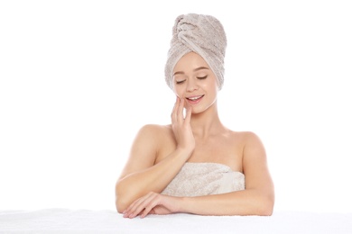 Photo of Portrait of young pretty woman with towels on white background