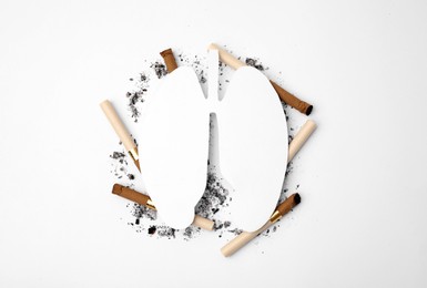 Photo of No smoking concept. Paper lungs and cigarettes on white background, flat lay