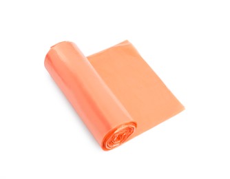 Photo of Roll of orange garbage bags isolated on white