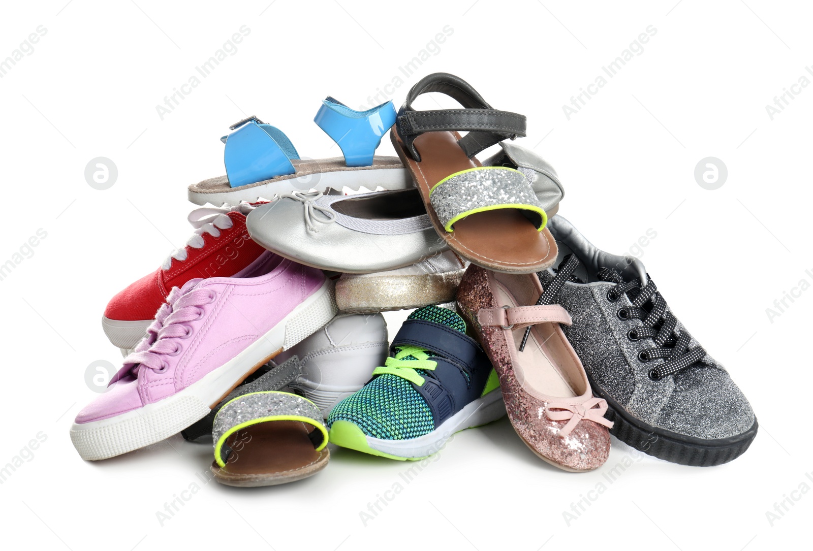 Photo of Pile of different shoes on white background