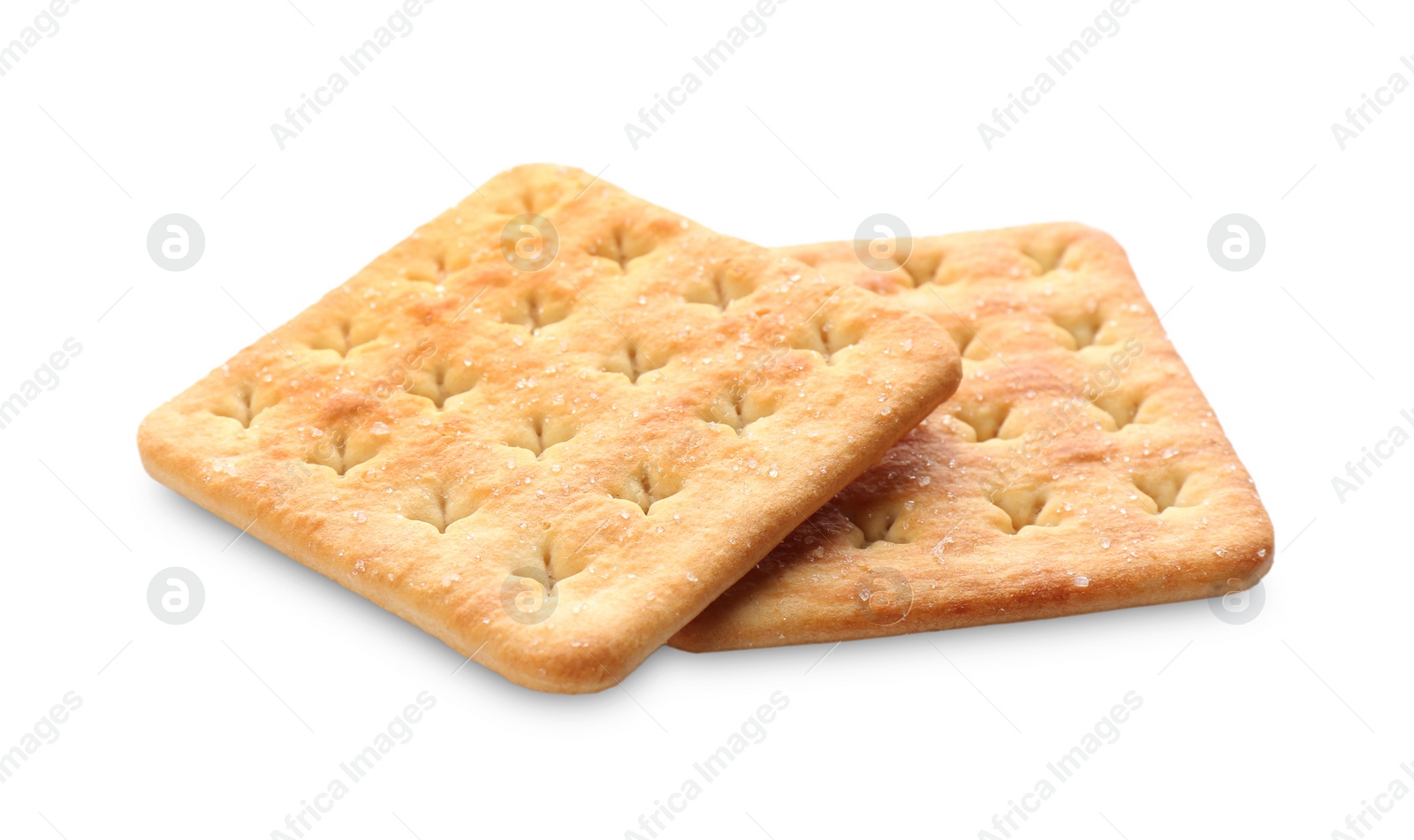 Photo of Crispy crackers isolated on white. Delicious snack