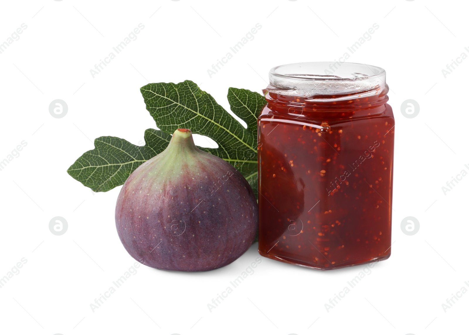 Photo of Jar of tasty sweet jam, fresh fig and green leaf isolated on white