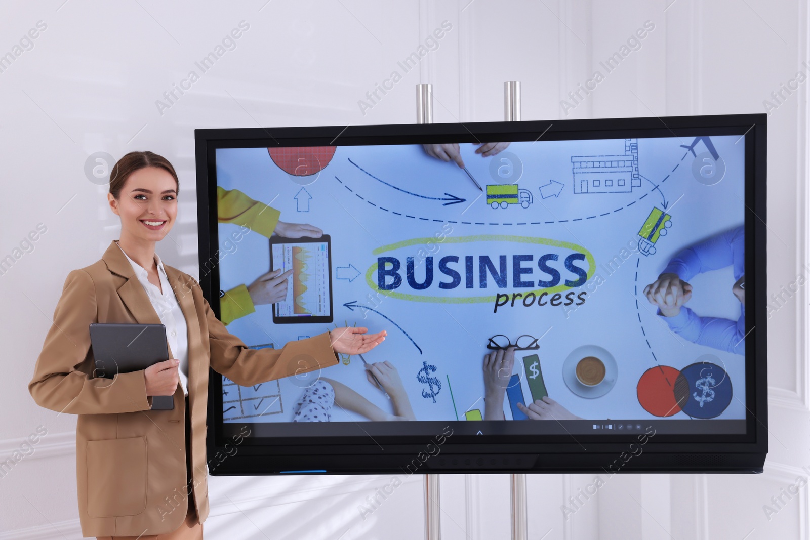 Photo of Business trainer using interactive board in meeting room