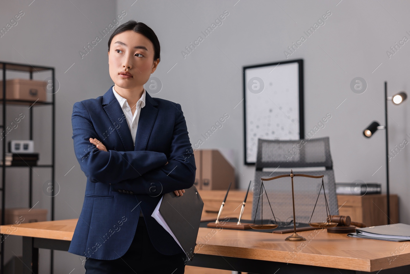 Photo of Portrait of notary with crossed arms in office. Space for text