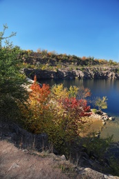 Photo of Picturesque view of beautiful lake surrounded by rocky hills