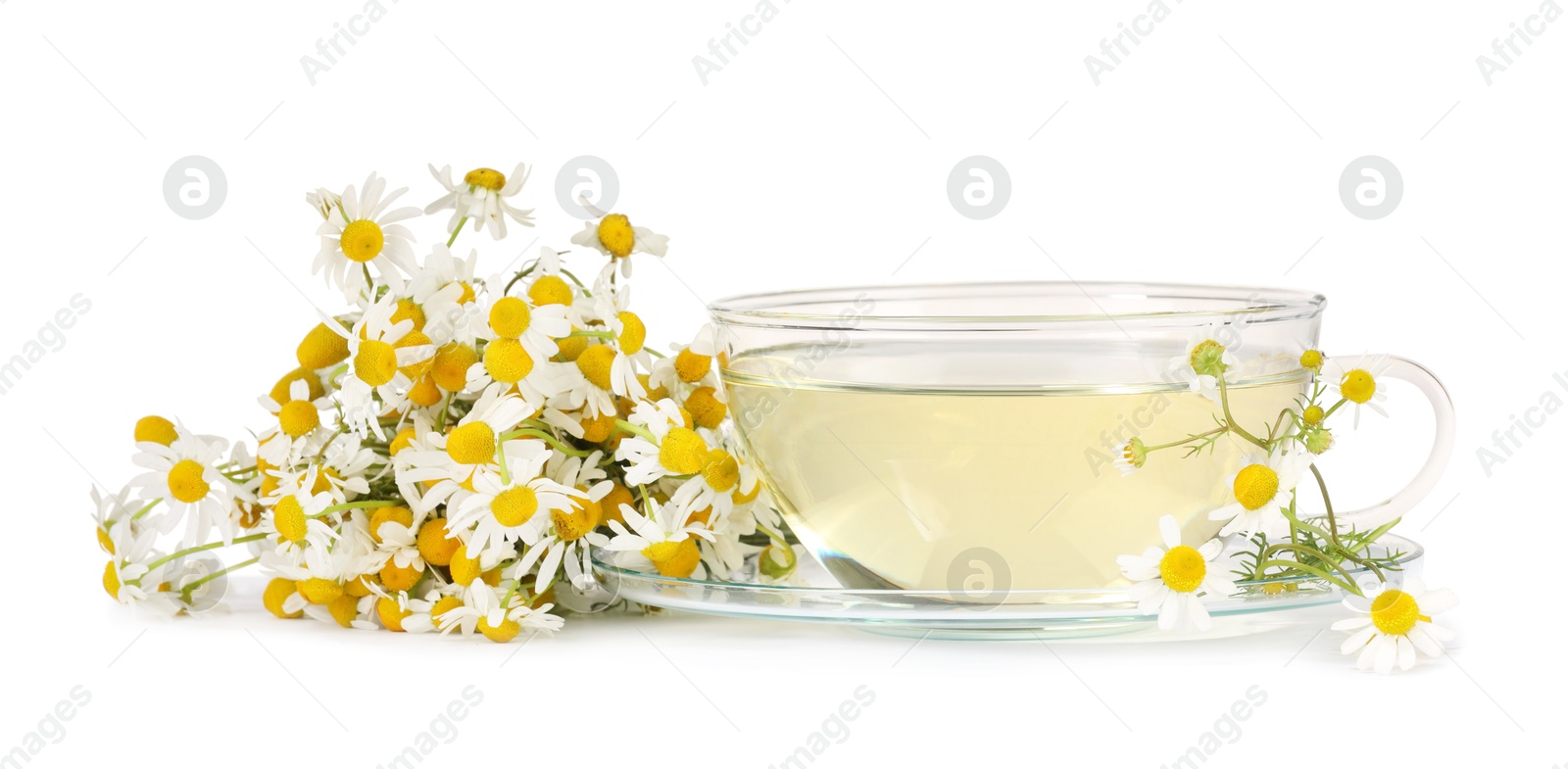 Photo of Aromatic herbal tea in glass cup with chamomile flowers isolated on white