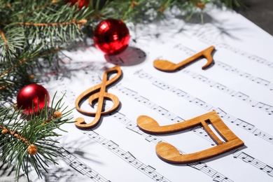 Composition with wooden music notes and decorations on sheets