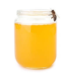 Photo of Jar with honey and bee on white background