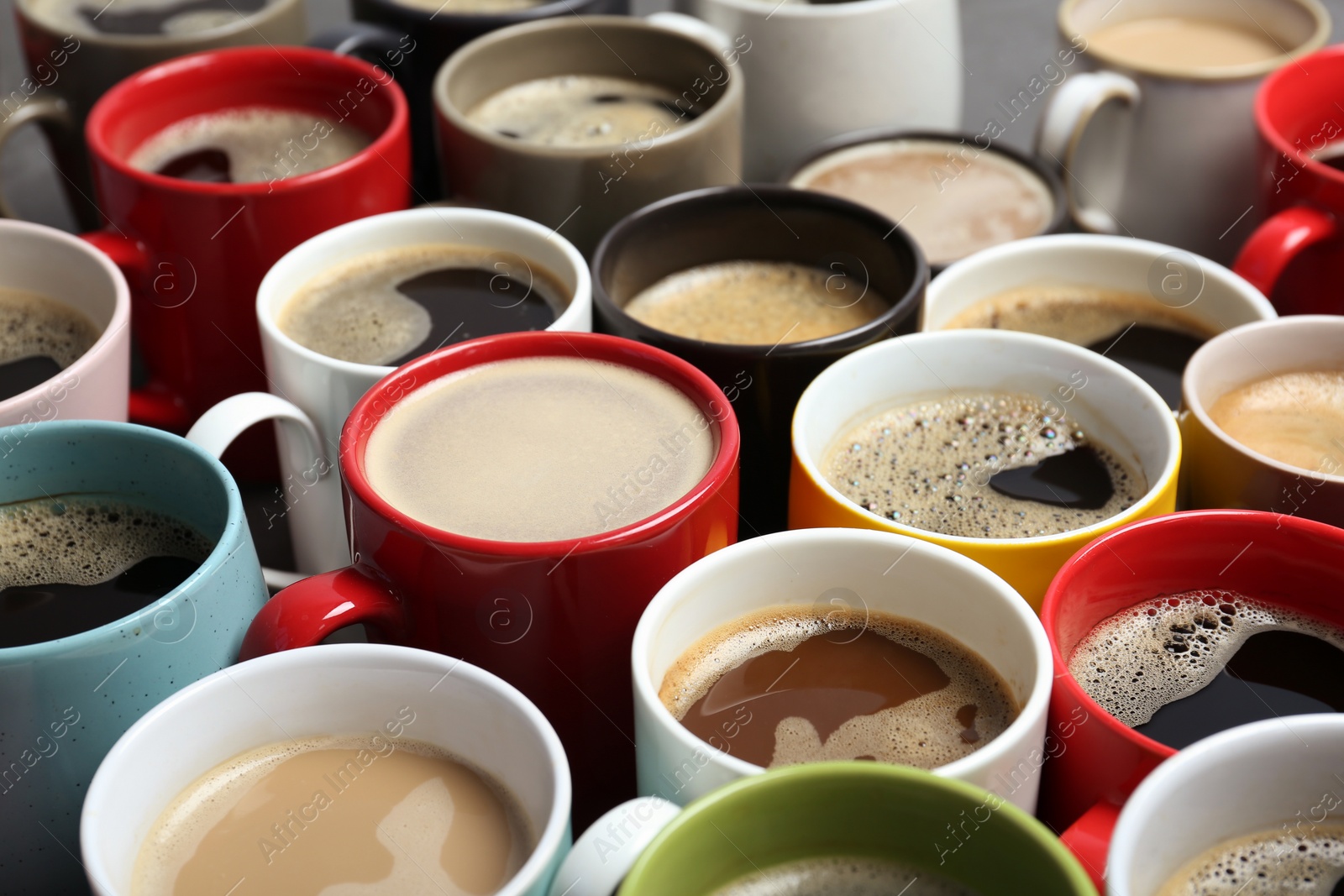 Photo of Many cups with tasty aromatic coffee, closeup