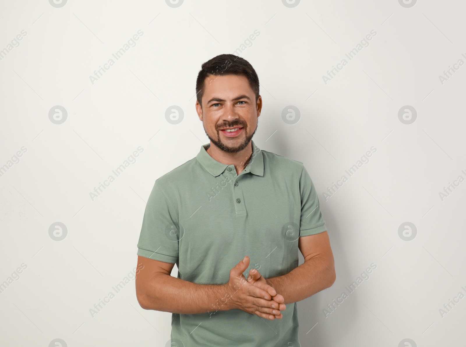 Photo of Portrait of handsome man on light background