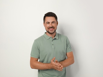 Photo of Portrait of handsome man on light background