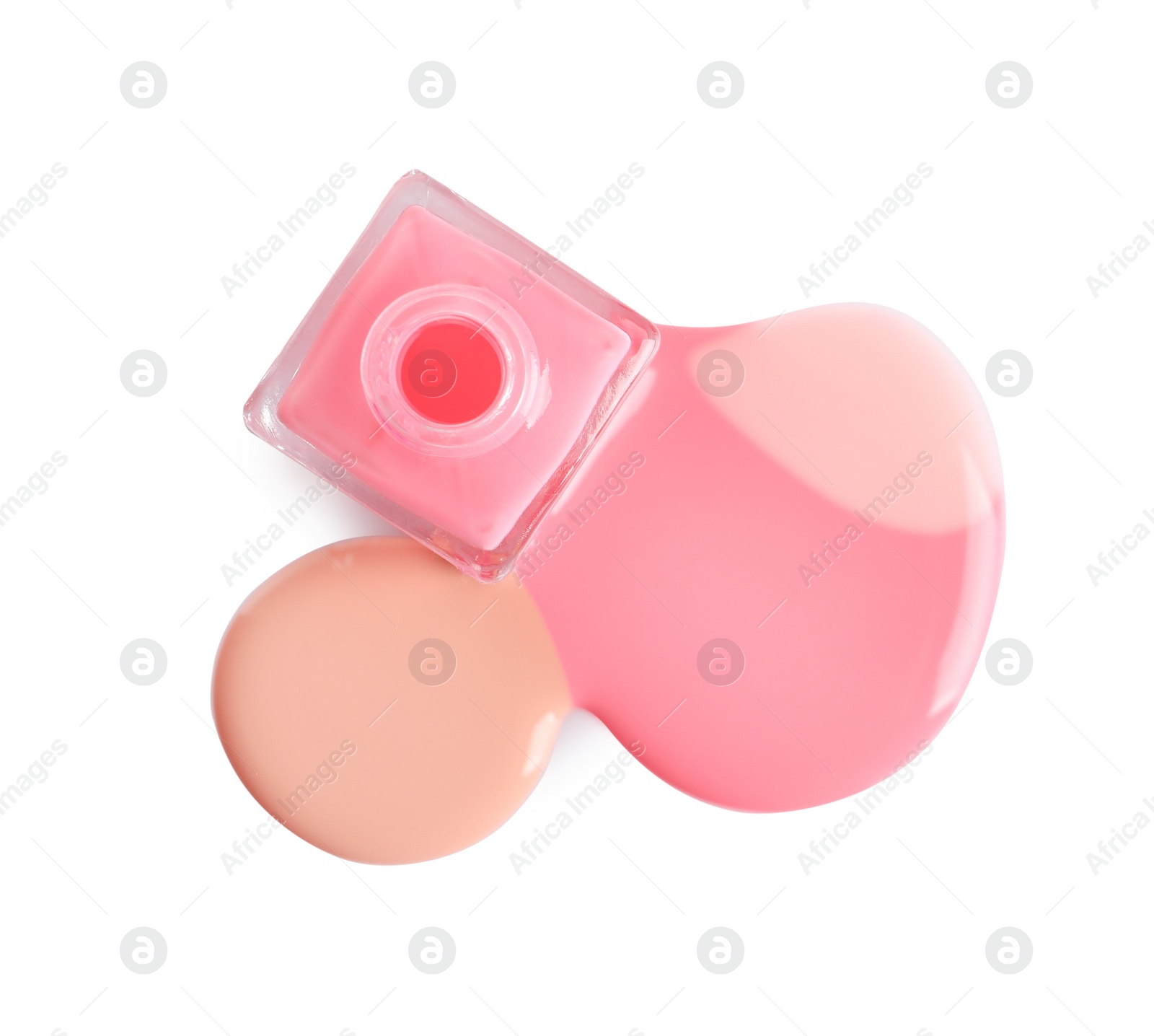 Photo of Spilled different nail polishes with bottle on white background, top view