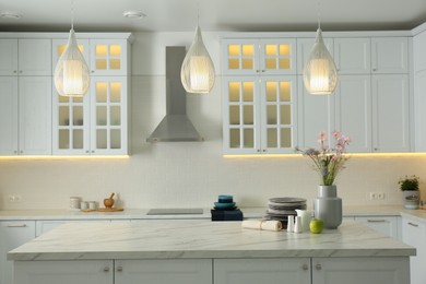 Photo of Modern kitchen interior with stylish white furniture