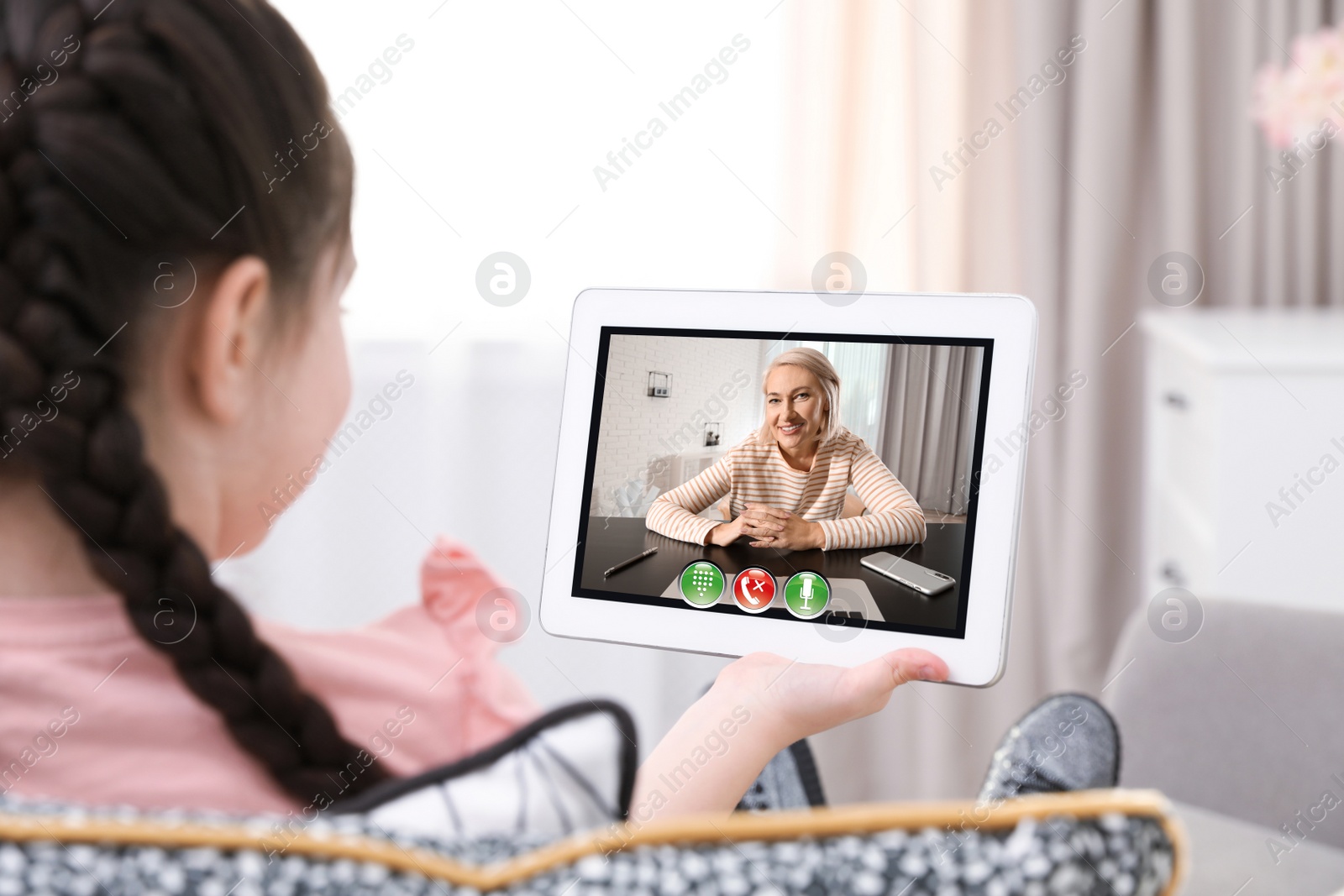 Image of Distance learning, studying at home. Girl having online school lesson during quarantine and lockdown due to Covid-19 pandemic