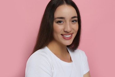 Photo of Portraitbeautiful young woman with elegant makeup on pink background