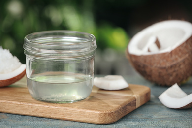 Coconut oil on light blue wooden table