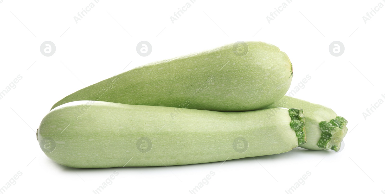 Photo of Fresh ripe green zucchinis isolated on white