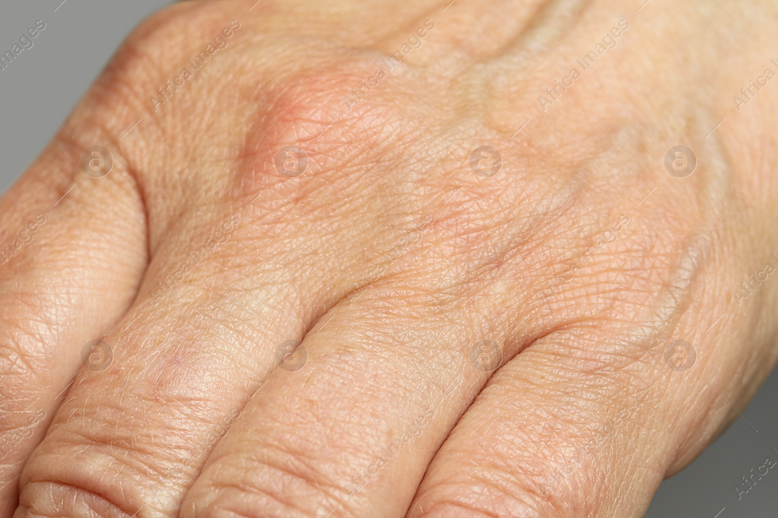 Photo of Closeup view of mature person with clean skin on hand