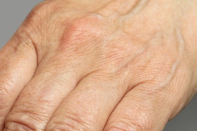 Closeup view of mature person with clean skin on hand