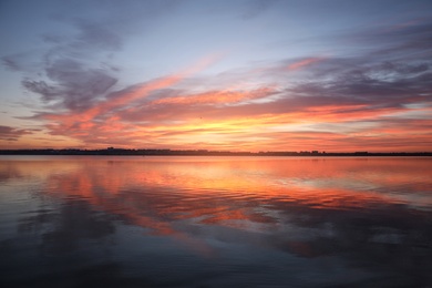 Photo of Picturesque view of beautiful sunset over river. Nature healing power