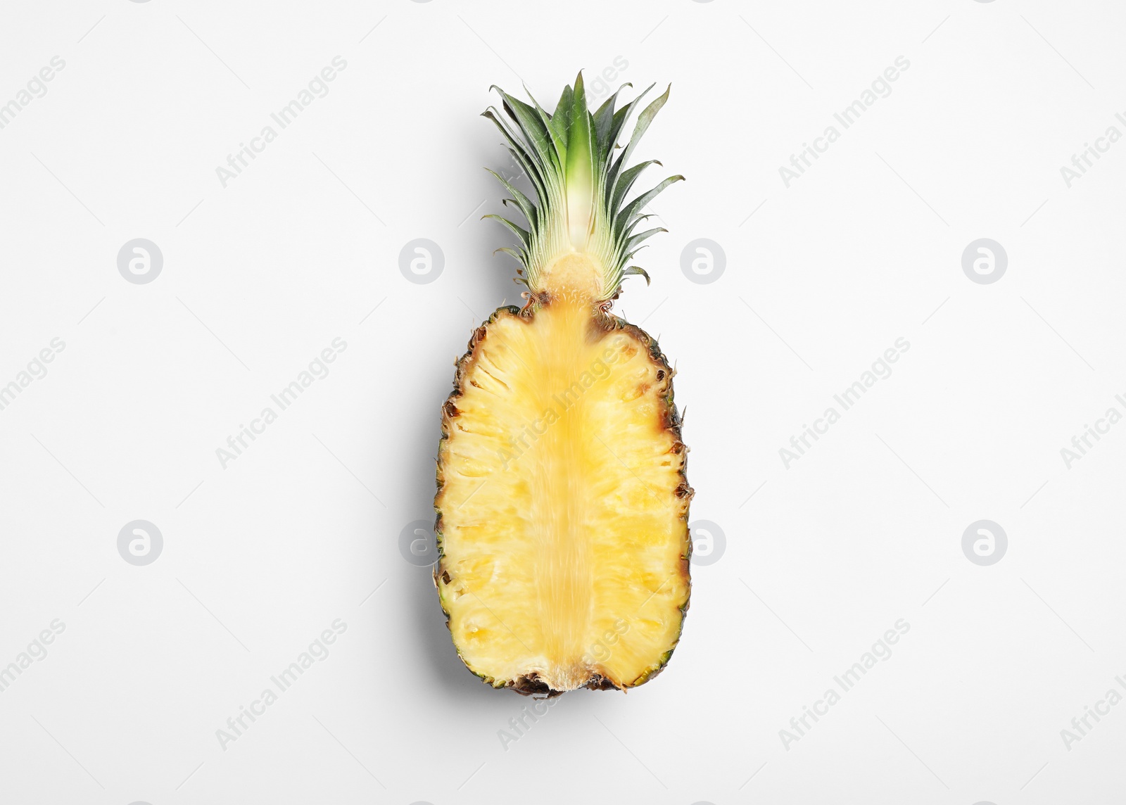 Photo of Half of raw pineapple on white background, top view